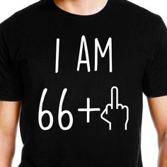 a man wearing a black t - shirt that says i am 28 + plus and pointing to the right