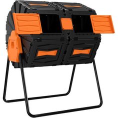 an orange and black stacking unit with four bins on it's legs