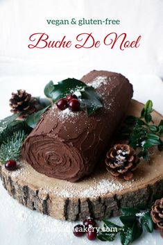 a piece of chocolate cake sitting on top of a wooden slice covered in frosting