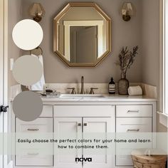 a bathroom with white cabinets and gray walls, including a large round mirror above the sink