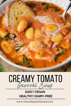 creamy tomato gnocchi soup in a white bowl with bread on the side and text overlay that reads, creamy tomato gnocchini soup