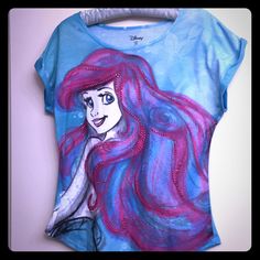 a t - shirt with an image of a mermaid on it