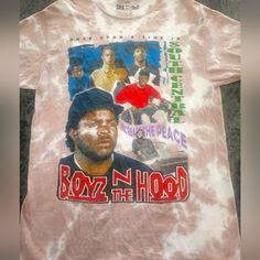 This Is A Classic T- Shirt From The Movie Boyz In The Hood. It Is 100% Cotton In A Beige & White Tie Dye Color With The Graphic Pic Of The Cast On Front, From The 1990's. 18in Pit To Pit. 27in Legnth. 90s Style Graffiti Print Top With Relaxed Fit, 90s Style Tops With Graffiti Print And Relaxed Fit, 90s Style Relaxed Fit Tops With Graffiti Print, 90s Style Streetwear Shirt For Spring, 90s Style Spring Shirt For Streetwear, 90s Style Spring Streetwear Shirt, Hip Hop Style Summer Fan Merchandise Tops, 90s Streetwear Tops With Front Print, Vintage Pink Top For Streetwear