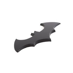 a black bat shaped object on a white background