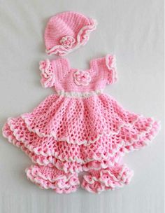 a crocheted baby dress and hat is shown on the cover of a book