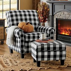 a plaid chair and ottoman in front of a fireplace with a coffee cup on it