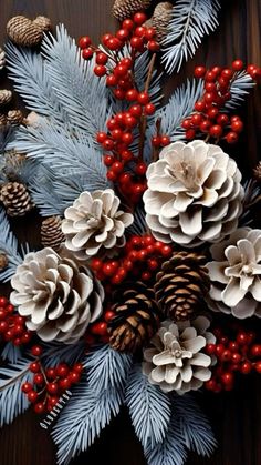 pine cones and berries are arranged on the table