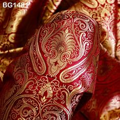 Maroon Brocade Fabric by the Yard Wedding Dress Sewing Crafting Indian Blended Banarasi Silk Curtains Home Décor Bridal Costume Table Runner. This is a beautiful heavy benarse blended silk brocade floral design fabric in Maroon and Gold. This brocade is great for any dress or jacket. ➤Product: Brocade Fabric ➤Fabric Type: Blended Silk (Viscose and Silk) Fine quality Zari Brocade Weaving from Banaras ➤Color: Maroon and Gold ➤Width: 44 inches. ➤Condition: New ➤Code: bg1481 ➤Listing for 1 Yard of fabric. ➤Care: Dry Clean Only This is known as "Kimkhab". During the Mughal period (1556-1707), when kimkhwāb was extremely popular with the rich, the great centres of brocade weaving were Benares (Vārānasi). You can use this fabric to make Dresses, Tops, Blouses, Jackets, Crafting, Clutches or Eveni Elegant Wedding Fabric With Motifs, Luxury Brocade Dupatta For Puja, Elegant Brocade Blouse Piece With Motifs, Traditional Embroidered Fabric For Eid And Wedding, Self Design Jamawar Embroidered Fabric For Wedding, Traditional Embroidered Fabric For Wedding And Eid, Self-design Jamawar Fabric For Wedding, Wedding Saree Fabric With Traditional Patterns, Eid Wedding Embroidered Fabric With Traditional Patterns