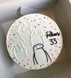 a birthday cake with an image of a penguin on it