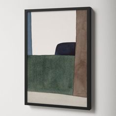 an abstract painting hangs on the wall