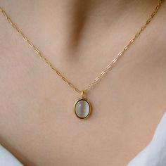 A delicate moonstone pendant suspended on a fine chain creates an ethereal statement. The luminescent stone catches light with subtle iridescence, while the minimal gold setting allows the natural beauty of the moonstone to take center stage. Specifications Finish: 18K gold platedCore: Titanium steelGemstone: OpalSize: 41 cm chain + 6 cm extender, W: 1 cm x H: 1.24 cm pendantClosure: Lobster clasp Minimal Gold, White Moon, Moonstone Pendant, Moon Necklace, Center Stage, Gold Set, Lobster Clasp, Moonstone, Natural Beauty