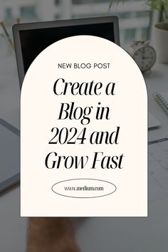 a laptop computer sitting on top of a desk next to a pen and paper with the words create a blog in 2012 and grow fast