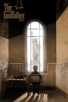 a person sitting at a desk in front of a window