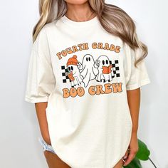 You will love this Halloween fourth grade crew shirt! This is the perfect trendy tee for fourth grade teachers and 4th grade teacher teams to wear during the fall/Halloween season and makes a great Halloween gift for new teachers! PRODUCTION TIME: 2-5 business days  SHIPPING TIME: 2-5 business days  PRODUCT DESCRIPTION: These ultra soft pigment dyed shirts are one of our best sellers, 100% Cotton. 100% ring spun cotton Preshrunk, soft-washed, garment-dyed fabric Set-in sleeves Double-needle stit Character Print Crew Neck Top For College, Fall School Spirit Graphic T-shirt, School Crew Neck T-shirt For Fall, Crew Neck T-shirt For School In Fall, Casual Fall T-shirt For School, Relaxed Fit T-shirt For School In Fall, School Spirit Crew Neck T-shirt With Character Print, School Spirit T-shirt With Character Print, Relaxed Fit School Spirit T-shirt For Fall