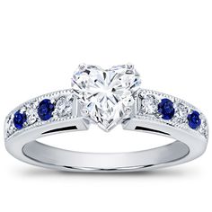 This pavé-set engagement setting features six brilliant cut round diamonds totaling 0.20cttw and four round cut blue sapphires. This setting is available in white gold, yellow gold, or platinum. Engagement Sets, Sapphire Engagement, Jewelry Gold, Gold Yellow, Blue Sapphire, Lab Grown Diamonds, Round Diamonds, Round Cut, Platinum