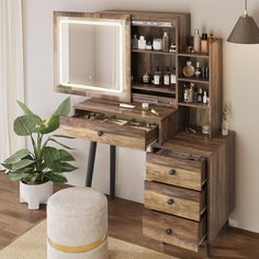 a wooden desk with drawers and a mirror on it in front of a potted plant