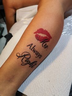 a person with a tattoo on their arm that says, we always kiss me and red lips