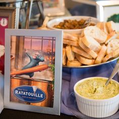 there is a plate of food with bread and dip on the table next to it