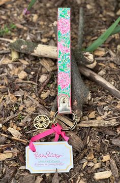 Featured in "Coming in Hot" Lilly Pulitzer Printed Leatherette Key Ring Featured in "Coming in Hot" Keychain with gold keyring and Patterned Full Leatherette Strap Lilly Logo Charm Attached Approximate Measurements: 3/4"W x 6 1/2"H Gold Polyutherane Accents Take a little Lilly wherever you go with this handy keychain, which features a leatherette strap and golden keyring. Handy Keychain, White Luggage, Peach Hair, Feather Hair Clips, Feather Flower, Druzy Crystal, Feathered Hairstyles, Gold Handles, Custom Watch