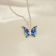 Cloisonne Enamel Butterfly Pendant, Handmade Georgian Enamel, Dainty Necklace Butterfly, Blue Butterfly Necklace, Georgian Cloisonne Enamel Blue Sterling Silver Necklace With Inlay, Blue Engraved Round Pendant Necklace, Silver Pendant With Black Enamel, Spiritual Enamel Round Pendant Necklace, Blue Engraved Pendant Necklace, Black Enamel Necklace For Gift, Enamel Hallmarked Jewelry For Gifts, Blue Necklace With Round Inlay, Hallmarked Enamel Jewelry For Gifts