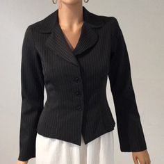 Wrapper Black Pinstriped Blazer Top With 3 Button Front And Shoulder Pads. No Pockets. Original Price $44.00 Armpit To Armpit Is 18’ Length Is 21” Fitted Long Sleeve Blazer With Buttons, Fitted Black Outerwear With Button Closure, Black Fitted Outerwear With Single Button, Fitted Black Outerwear With Single Button, Black Button-up Outerwear For Office, Black Blazer With Snap Buttons And Lapel Collar, Black Blazer With Snap Buttons And Lapel, Black Blazer With Button Closure For Office, Elegant Fitted Blazer With Snap Buttons