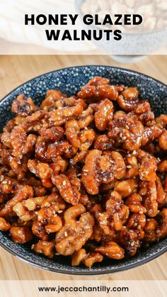 honey glazed walnuts in a blue bowl on a wooden table with text overlay