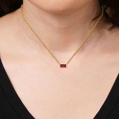 10K Yellow Gold Created Gemstone Horizontal Solitaire 18" Necklace  This simple, but sophisticated necklace features your choice of a single, rectangular, step-cut gemstone paired with a fashionable rope chain.         Necklace approx. 18"L; drop approx. 1/8"L x 1/4"W     Stamped 10K yellow gold     Rope chain; spring ring clasp   Stone Information       All sizes and weights approximate     Created Emerald - Step-cut baguette; 0.16ct     Created Ruby - Step-cut baguette; 0.23ct Rectangular Gemstone Necklace For Formal Occasions, Formal Rectangular Gemstone Necklace, Modern Rectangular Birthstone Jewelry, Formal Red Rectangular Necklaces, Rectangular Gemstone Necklace For Anniversary, Baguette Necklace, Gold Rope Chains, Rope Chain Necklace, Step Cut