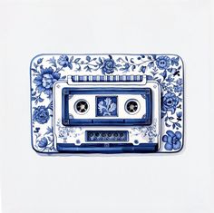 a blue and white cassette player with flowers on it