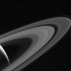 saturn and its rings in black and white