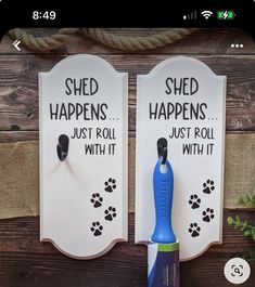 two magnets that say shed happens, just roll with it and one has a brush