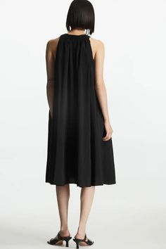 RACER-NECK MIDI DRESS - BLACK - COS Daywear Midi Dress With Pleated Back, Daywear Midi Length Dresses With Pleated Back, Chic High Neck Midi Dress For Daywear, Black Midi Dress With Pleated Back, Pleated Back Midi Maxi Dress For Daywear, Casual Halter Neck Midi Dress For Daywear, Chic Midi Halter Dress For Daywear, Summer Midi Dress With Pleated Back, Chic Smocked Back Midi Dress In Viscose