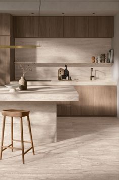 a kitchen with an island and stools in it