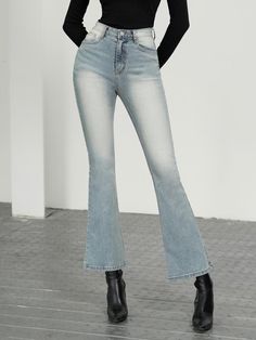 The garment shown is a pair of jeans with a flared silhouette, which creates a bell-shaped look towards the hem. They have a faded wash effect on the thighs and seat, which gives them a worn and casual appearance. The jeans are fitted with a contoured waistband that is designed to sit smoothly around the hips. The visible stitching is done in a thread that offers a subtle contrast to the fabric, providing a classic denim aesthetic.- The faded wash effect adds dimension and a sense of lived-in comfort to the jeans, suggesting a casual, everyday style.- The flared legs give a nod to vintage fashion trends while offering a contemporary twist to modern wardrobes.- With a smooth waistband, these jeans are likely to provide a snug fit without gapping at the back, ensuring both style and comfort. Denim Flares With Five Pockets, Denim Blue Flare Jeans With Five Pockets, Trendy Faded Flare Jeans, Denim Bottoms With Frayed Flared Hem, Denim Jeans With Five Pockets And Flared Hem, Medium Wash Denim Flares With Flared Hem, Medium Wash Denim Jeans With Flared Hem, Medium Wash Flared Hem Denim Jeans, Denim Blue Flare Jeans With Frayed Hem