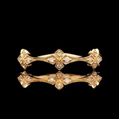 An 18k yellow gold diamond decorative band.  SR2535 Weight: 2.9 grams Size: 7 Diamond (20) Round Color: G-H Clarity: VS2-SI1 Carat Weight: 0.15 ctw Luxury 14k Gold Jewelry With Decorative Band, Luxury Gold Diamond Ring With Rose Cut Diamonds, Luxury Gold Diamond Ring With Rose Cut, Luxury Gold Diamond Ring With Diamond Accents, Luxury Diamond Ring With Decorative Band, Luxury Gold Diamond Ring With Accents, Luxury 14k Gold Diamond Ring, Luxury Gold Diamond Ring With Single Cut Diamonds, Ceremonial Yellow Gold Diamond Ring