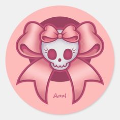 a pink sticker with a skull wearing a bow