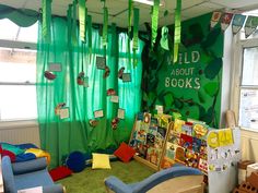 a child's playroom with green curtains and pictures on the wall, toys for children