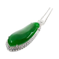 Please check out the HD video! Here is a rare imperial green Jade and diamond pendant. It is certified. The pendant is set in 18k white gold and diamonds. Not only does this jade have the best color, it is also got size and thickness. The jade material used is the center of the rough (best material). There are diamonds that surrounds the imperial jade center stone, diamonds on top of the Jade and also diamonds in the back totaling 2.143Cts. The untreated / unenhanced natural jade is translucent. Imperial Jade, Diamond Drop Pendant, Carved Heart, Drop Pendant Necklace, White Gold Chains, Best Color, Jade Jewelry, Statement Pendant, Natural Jade