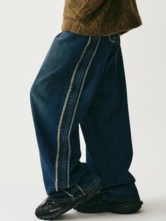 These wide denim pants feature unique fringed raw-edge detail along sides and back pockets, and brush washing. They're made from seasonless 13.05oz cotton denim and neatly finished with durable sewing and rivets.- Zip and logo-engraved button fastening  - Five pockets- Raw edge fringe detail at side and back pocket- Logo leather label at back- Bursh washing- High quality sewing finish (double stitch and chain stitch)- Wide fit - Unisex wear Medium Wash Rigid Denim Pants With Frayed Hem, Dark Wash Rigid Denim Jeans With Frayed Hem, Streetwear Dark Wash Flare Jeans With Frayed Hem, Dark Wash Flare Jeans With Frayed Hem For Streetwear, Denim Blue Jeans With Frayed Hem, Denim Blue Rigid Denim Jeans With Frayed Hem, Urban Denim Pants With Frayed Hem, Denim Pants With Frayed Hem, Denim Pants With Frayed Hem And Standard Cut Leg