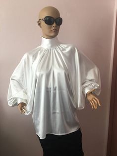 "This is a very stylish Womens Silk blouse. It is comfortable and cozy. Made for a free flowing fit. Great for all year around and for any special occasion or casual day can be dressed up or dressed down. SIZE CHART SIZE S - US 6, UK 8, EU 36 bust: bust around 34.5\"/90cm Waist: waist around 27.5\"/70cm Hips: hips around 34.5\"/90cm SIZE M - US 8, UK 10, EU 38 bust: bust around 37.5\"/95cm Waist: waist around 29.5\"/75cm Hips: hips around 37.5\"/95cm SIZE L - US 10, UK 12, EU 40 bust: bust aroun Classic White Satin Blouse, Silk Bishop Sleeve Top For Evening, Elegant Solid Color Blouse With Bishop Sleeves, Silk Tops With Bishop Sleeves For Evening, Feminine Bishop Sleeve Party Blouse, Elegant Long Sleeve Satin Blouse, Feminine Party Blouse With Bishop Sleeves, Classic Summer Blouse For Party, Classic Fall Party Blouse