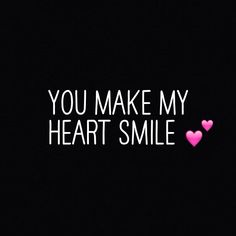 the words you make my heart smile written in white on a black background with pink hearts