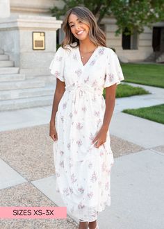 Maddie is 5'7.5" and wearing a smallLena is 5'10" and wearing a 1X - Runs TTS, with elastic waist in back - Functioning drawstring at the waist to create a flattering fit on all bodytypes - STUNNING white fabric with dainty pink floral and subtle dots - Dainty lace trim along the neckline - Swirly, twirly tiered skirt for ultimate wow effect - Slight flutter sleeve for a comfortable fit - MSC EXCLUSIVE design with our signature higher neckline for more coverage - Available in sizes XS-3X Cute Modest Dresses, Modest Boutique, Church Fits, Teacher Clothes, Curvy Dress, Tier Skirt, Plus Dresses, Dress With Cardigan, Women Clothing Boutique