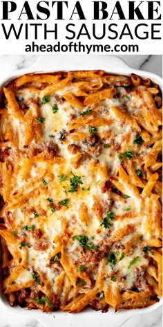 a casserole dish filled with pasta and cheese, topped with parmesan