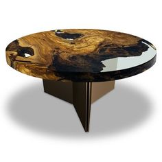 an oval table with black and gold wood inlays