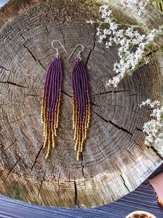 "These long purple fringe beaded earrings are made of high quality Czech beads. Colors: purple, sparkle brown, sparkle gold. -------------------------------------------- ✦ The Details: ✔ Made with quality Czech beads ✔ Made using strong bead weaving thread. ✔ Lenght: app.4.5 inches ✔ Stainless steel earrings hooks There may be some color discrepancies which is due to the different monitor settings ✦ All earrings hooks are nickel and lead free! ✦ More great boho earrings found here https://www.et Purple Beaded Fringe Drop Earrings, Purple Dangle Tassel Jewelry, Purple Dangle Jewelry With Tassels, Purple Fringe Beaded Earrings As Gift, Purple Beaded Fringe Earrings For Gift, Purple Fringe Beaded Earrings For Gift, Purple Beaded Earrings With Tassels For Gift, Purple Dangle Tassel Earrings With Fringe, Purple Fringe Tassel Earrings Gift