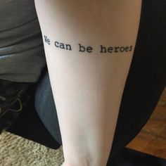 a person with a tattoo on their arm that says, we can be heros