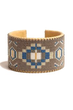 a brown and blue beaded bracelet on a white background