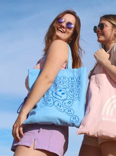 This adorable tote bag features the cutest smiley pattern. It's the perfect go-to reusable tote! PRODUCT DETAILS: -dimensions - 14" x 16" -100% heavy cotton canvas -all designs are created by orijenal Questions?? Please don't hesitate to contact us! Fun Cotton School Bags, Blue Bags With Graphic Print For Daily Use, Playful Cotton School Bags, Trendy Blue Canvas Bag For Daily Use, Everyday Blue Cotton Bag, Everyday Blue Cotton Bags, Blue Trendy Canvas Bag For Everyday Use, Trendy Blue Canvas Bag For Everyday Use, Cute Blue Cotton Bags