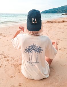 Want it in a hoodie? Find it here: https://www.etsy.com/listing/1655535622/palm-tree-hoodie-coastal-vibes-christian +DETAILS+ -Comfort Colors Tee -Design printed via DTG (direct to garment) where special ink is directly jetted onto the fabric, creating a longer lasting design. -100% ring-spun cotton -Medium fabric  -Relaxed fit -To achieve the oversized look in the photos, we recommend sizing two sizes up, otherwise, use size chart to find your best fit. +SIZING+ Please see size chart in photos Tee Design Print, Vacation Crew Neck T-shirt With Palm Tree Print, Spring Crew Neck T-shirt With Palm Tree Print, Palm Tree Print Vacation T-shirt, Tropical Crew Neck T-shirt With Palm Tree Print, Relaxed Fit Palm Tree Print Beachy T-shirt, Ocean Shirt, Tree Shirt, Comfort Colors Tee