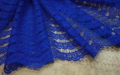 Chantilly Lace Width: 1.5 m / 59 inch listed for 1 yard Colors: royal blue Style: French The width of the lace, parallel to the edge, is 47 strips. Lace chantilly - a luxury that came from the past To create a beautiful wedding dress, you need not only a talent for designers and the ability to sew, but also beautiful quality fabrics. Chantilly lace is an excellent option, both for decoration and for making a completely wedding dress, because it is one of the most beautiful and popular types of l Blue Lace With Lace Trim For Wedding, Blue Lace For Wedding, Blue Lace With Patchwork For Party, Blue Lace Patchwork For Wedding, Blue Lace Patchwork For Party, Blue Lace Fabric, Reception Dresses, Black Lace Fabric, Sewing Wedding Dress