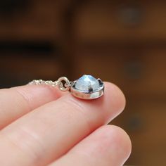 I designed this prong setting to be small but weighty. Hand cast in sterling silver the 8mm rainbow moonstones can be worn everyday and it puts out a great flash when the light hits it. The setting measures 7/16ths of an inch tall.I ship USPS First Class Mail in a gift box. Shipping upgrades and gift messages available at checkout. Blue Moonstone, Moonstone Necklace, Hand Cast, Moon Stone, Silver Roses, Rainbow Moonstone, Rose Cut, Gemstone Pendant, Prong Setting